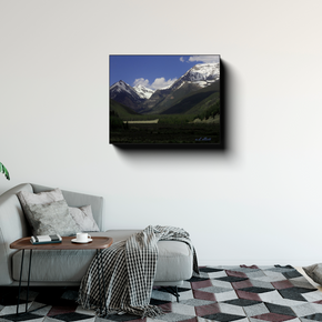 Mount Bierstadt canvas photograph displayed above a gray sofa in a modern living room with a side table and patterned rug.