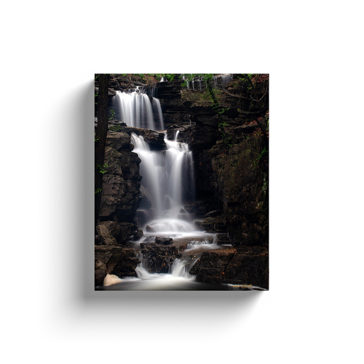 A long exposure photograph of Norwood Falls taken by the photographer a.d. elliott.  Printed on high quality, artist grade stock and folded around a lightweight frame to give them a gorgeous, gallery ready appearance. With acid free ink that will last without fading or chipping, Features a scratch-resistant UV coating. Wipes clean easily with a damp cloth or to remove dust, vacuum gently using a soft brush attachment.
