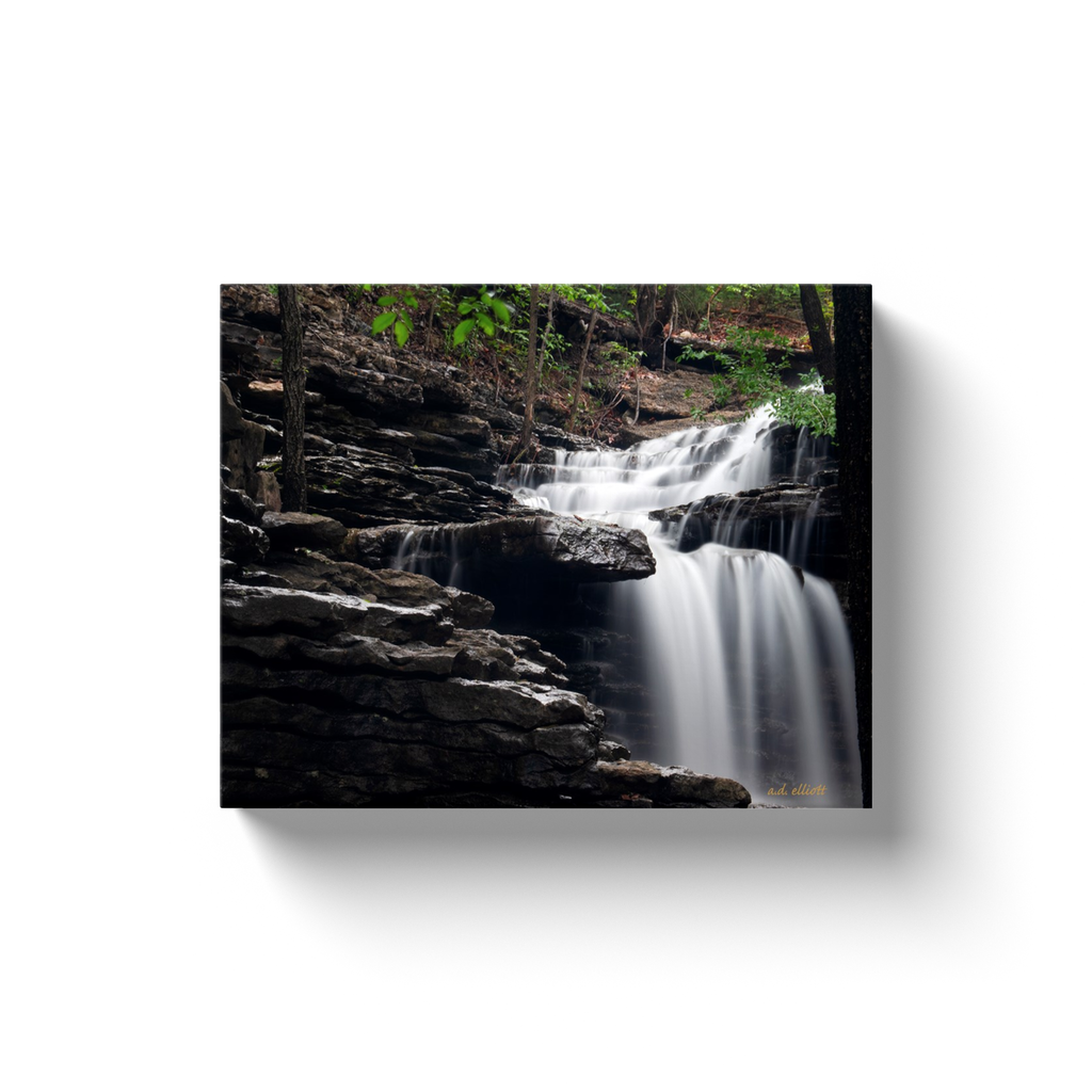 A long exposure photograph of Norwood Falls Bella Vista Arkansas  Printed on high quality, artist-grade stock and folded around a lightweight frame to give them a gorgeous, gallery-ready appearance. With acid-free ink that will last without fading or chipping, Features a scratch-resistant UV coating. Wipes clean easily with a damp cloth or to remove dust, vacuum gently using a soft brush attachment.
