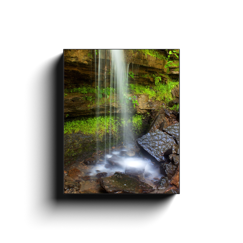 A long exposure photograph of Twin Falls at Devil's Den State Park in Winslow Arkansas. Taken by the photographer a.d. elliott - Take the Back Roads - #TaketheBackRoads  Printed on high quality, artist-grade stock and folded around a lightweight frame to give them a gorgeous, gallery-ready appearance. With acid-free ink that will last without fading or chipping, Features a scratch-resistant UV coating. Wipes clean easily with a damp cloth or to remove dust, vacuum gently using a soft brush attachment.