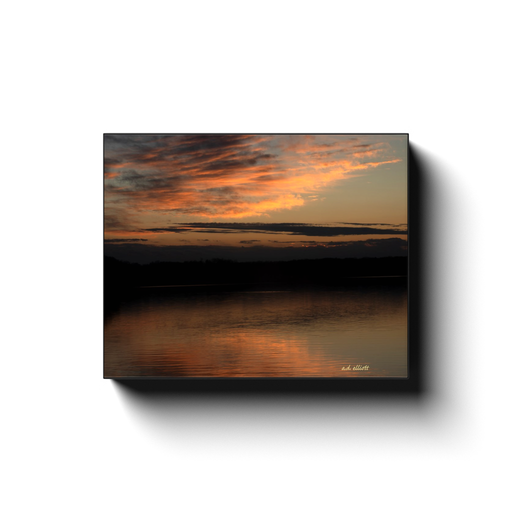 A long exposure photograph of a sunset over Loch Lomond in Bella Vista Arkansas, taken by the nature photographer a.d. elliott.  Printed on high quality, artist grade stock and folded around a lightweight frame to give them a gorgeous, gallery ready appearance. With acid free ink that will last without fading or chipping, Features a scratch-resistant UV coating. Wipes clean easily with a damp cloth or to remove dust, vacuum gently using a soft brush attachment.
