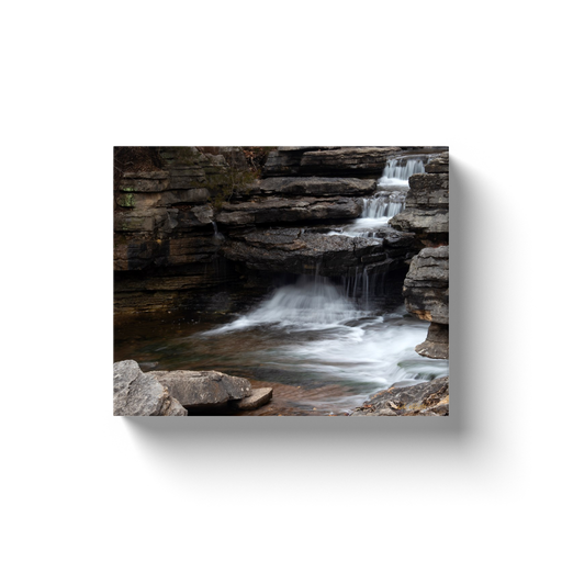 A long exposure photograph of the Lake Ann Spillway located in Bella Vista Arkansas taken by the Arkansas Photographer a.d. elliott.  Printed on high quality, artist-grade stock and folded around a lightweight frame to give them a gorgeous, gallery-ready appearance. With acid-free ink that will last without fading or chipping, Features a scratch-resistant UV coating. Wipes clean easily with a damp cloth or to remove dust, vacuum gently using a soft brush attachment.