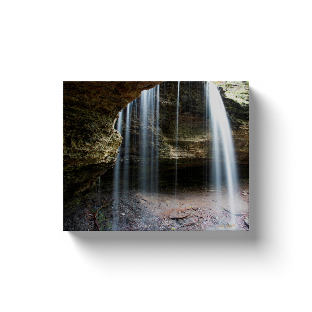 A long exposure photograph of water pouring over a bluff.  Printed on high quality, artist-grade stock and folded around a lightweight frame to give them a gorgeous, gallery-ready appearance. With acid-free ink that will last without fading or chipping, Features a scratch-resistant UV coating. Wipes clean easily with a damp cloth or to remove dust, vacuum gently using a soft brush attachment.