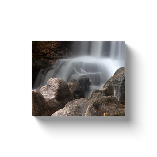 A long exposure photograph of Tanyard Creek Falls in Bella Vista Arkansas. Taken by the Arkansas photographer a.d. elliott. #TaketheBackroads  Printed on high-quality, artist-grade stock and folded around a lightweight frame to give them a gorgeous, gallery-ready appearance. With acid-free ink that will last without fading or chipping, Features a scratch-resistant UV coating. Wipes clean easily with a damp cloth or to remove dust, vacuum gently using a soft brush attachment.
