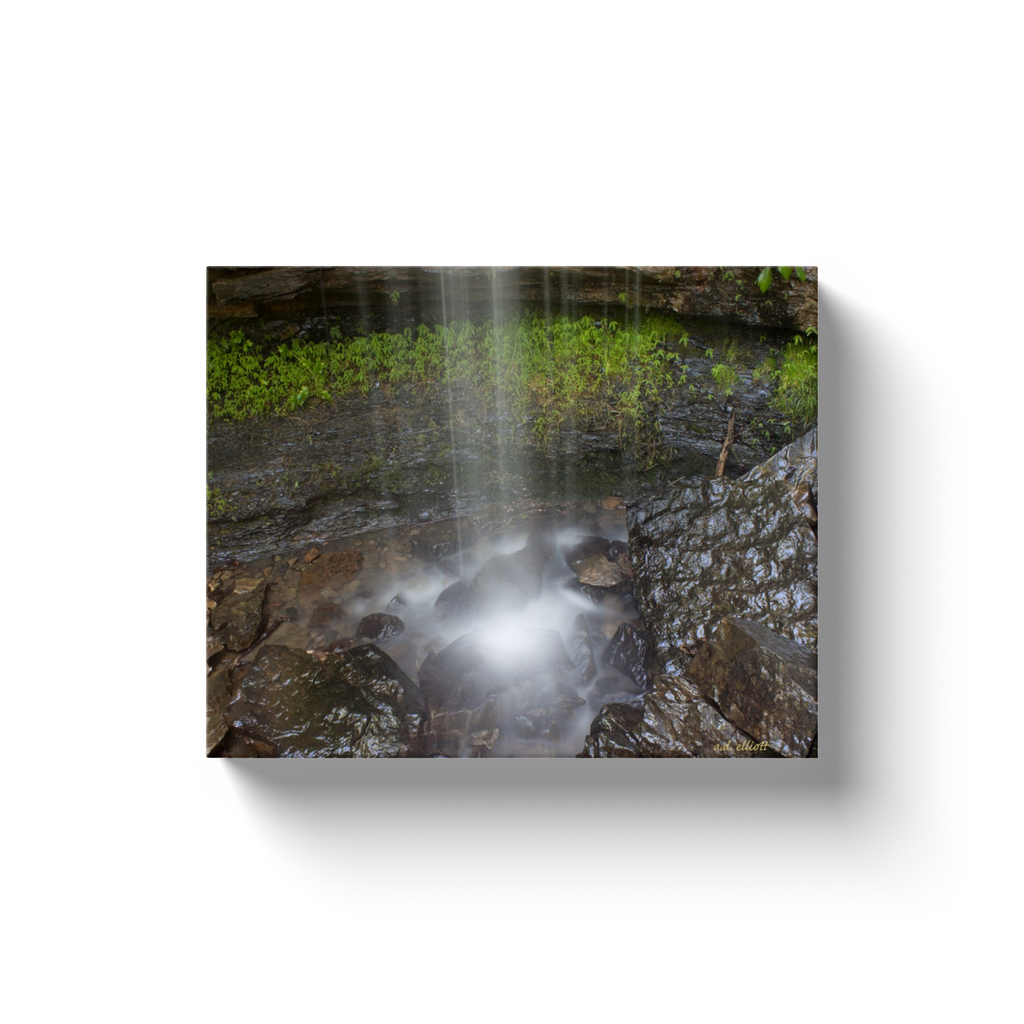 A long exposure photograph of a waterfall at Devil's Den State Park Arkansas. Taken by the Arkansas photographer a.d. elliott. #TaketheBackRoads  Printed on high quality, artist grade stock and folded around a lightweight frame to give them a gorgeous, gallery ready appearance. With acid free ink that will last without fading or chipping, Features a scratch-resistant UV coating. Wipes clean easily with a damp cloth or to remove dust, vacuum gently using a soft brush attachment.