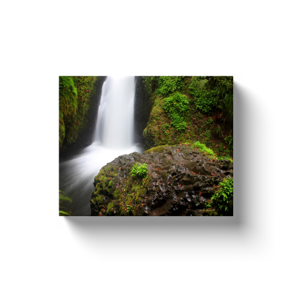 A long exposure photograph of Bridal Veil Falls, Columbia River Gorge taken by the photographer a.d. elliott.  Printed on high-quality, artist-grade stock and folded around a lightweight frame to give them a gorgeous, gallery ready appearance. With acid free ink that will last without fading or chipping, Features a scratch-resistant UV coating. Wipes clean easily with a damp cloth or to remove dust, vacuum gently using a soft brush attachment.