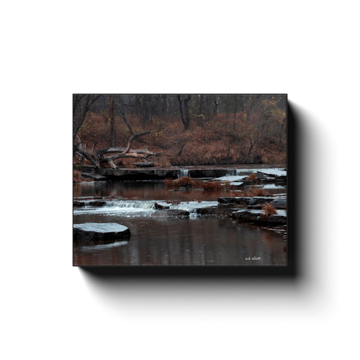 A long exposure photograph of Sand Creek Falls, located at Osage Hills State Park Oklahoma. Taken by the photographer a.d. elliott - Take the Back Roads - #TaketheBackRoads  Printed on high quality, artist-grade stock and folded around a lightweight frame to give them a gorgeous, gallery-ready appearance. With acid-free ink that will last without fading or chipping, Features a scratch-resistant UV coating. Wipes clean easily with a damp cloth or to remove dust, vacuum gently using a soft brush attachment.