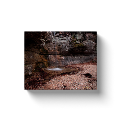 A long exposure photograph of Road 299 waterfall, located near Forum Arkansas. Taken by the Arkansas photographer a.d. elliott.  Printed on high quality, artist-grade stock and folded around a lightweight frame to give them a gorgeous, gallery-ready appearance. With acid-free ink that will last without fading or chipping, Features a scratch-resistant UV coating. Wipes clean easily with a damp cloth or to remove dust, vacuum gently using a soft brush attachment.
