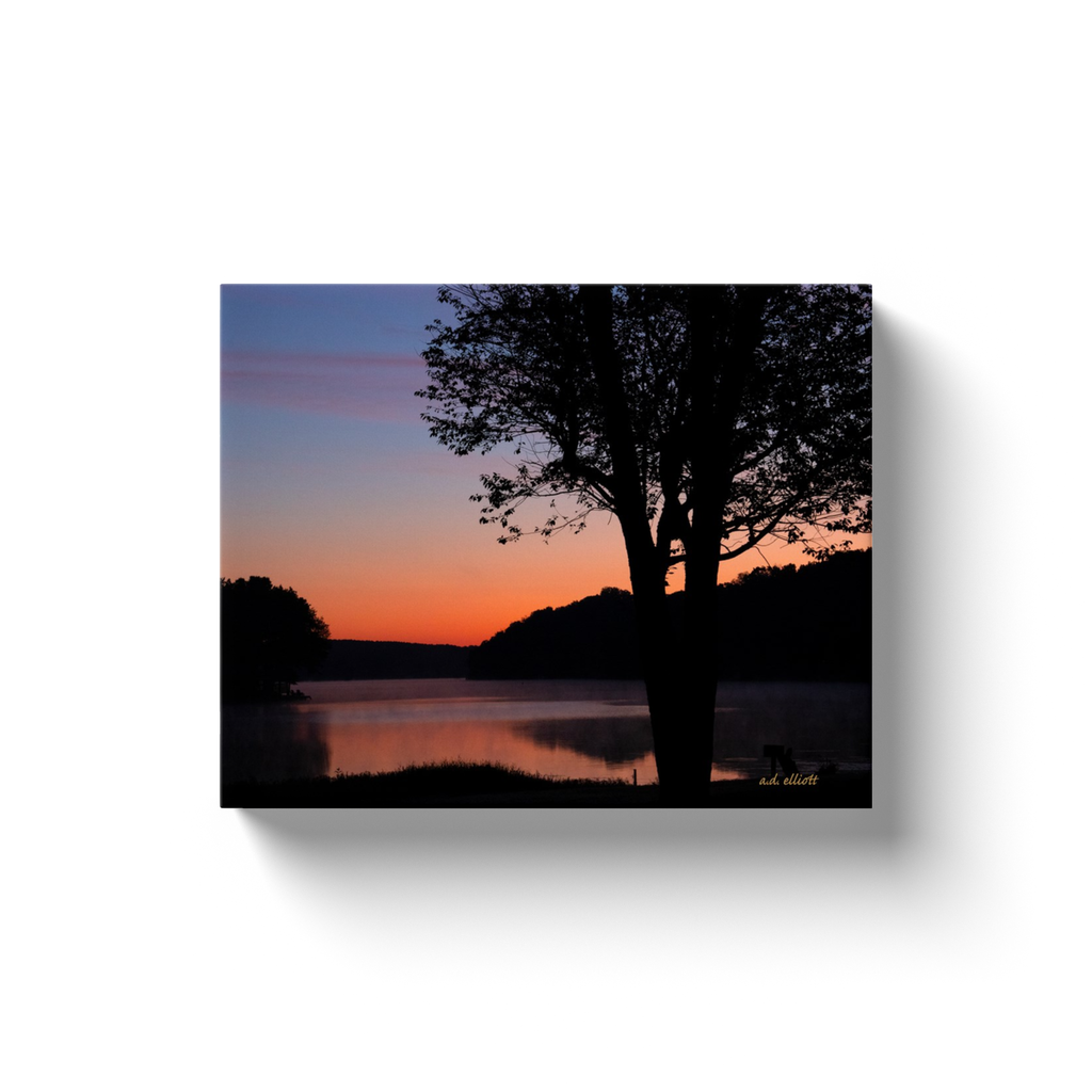 A landscape photograph of Loch Lomond Bella Vista Arkansas taken by the Arkansas photographer a.d. elliott.  Printed on high quality, artist-grade stock and folded around a lightweight frame to give them a gorgeous, gallery-ready appearance. With acid-free ink that will last without fading or chipping, Features a scratch-resistant UV coating. Wipes clean easily with a damp cloth or to remove dust, vacuum gently using a soft brush attachment.